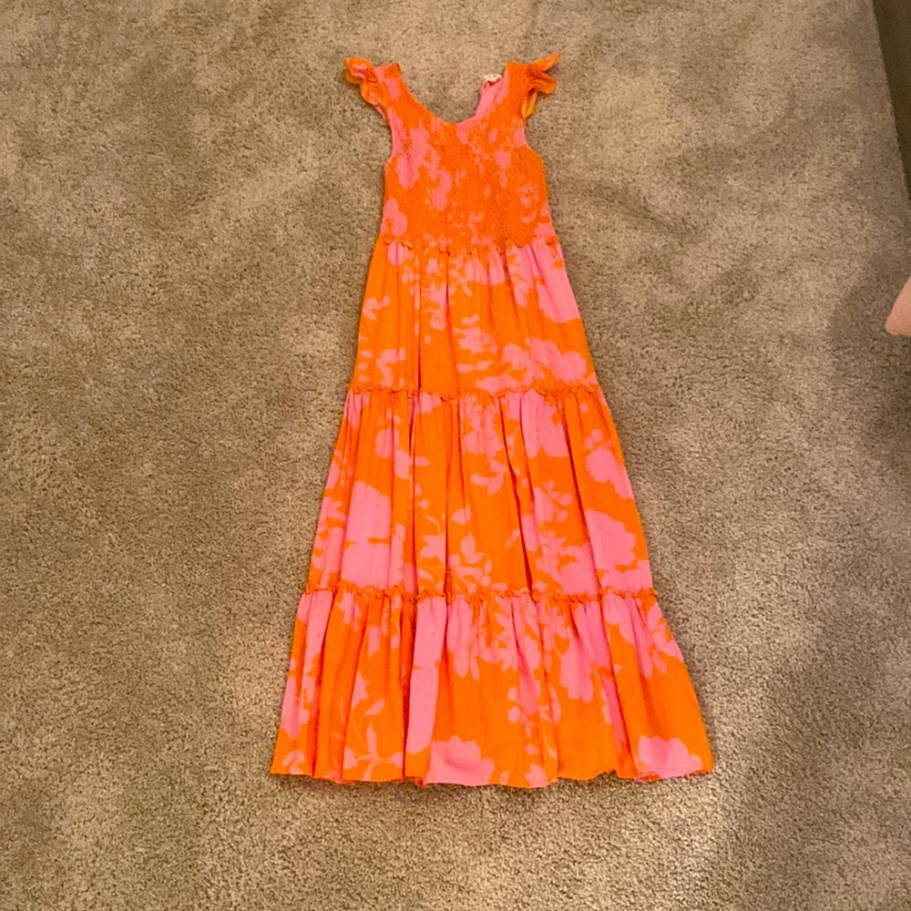 This is a orange dress with pink flowers